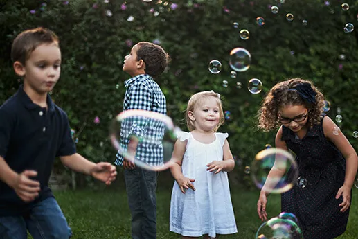 Kids Outside With Bubbles