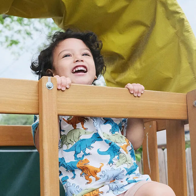Weekend Care Program Boy on playground equipment