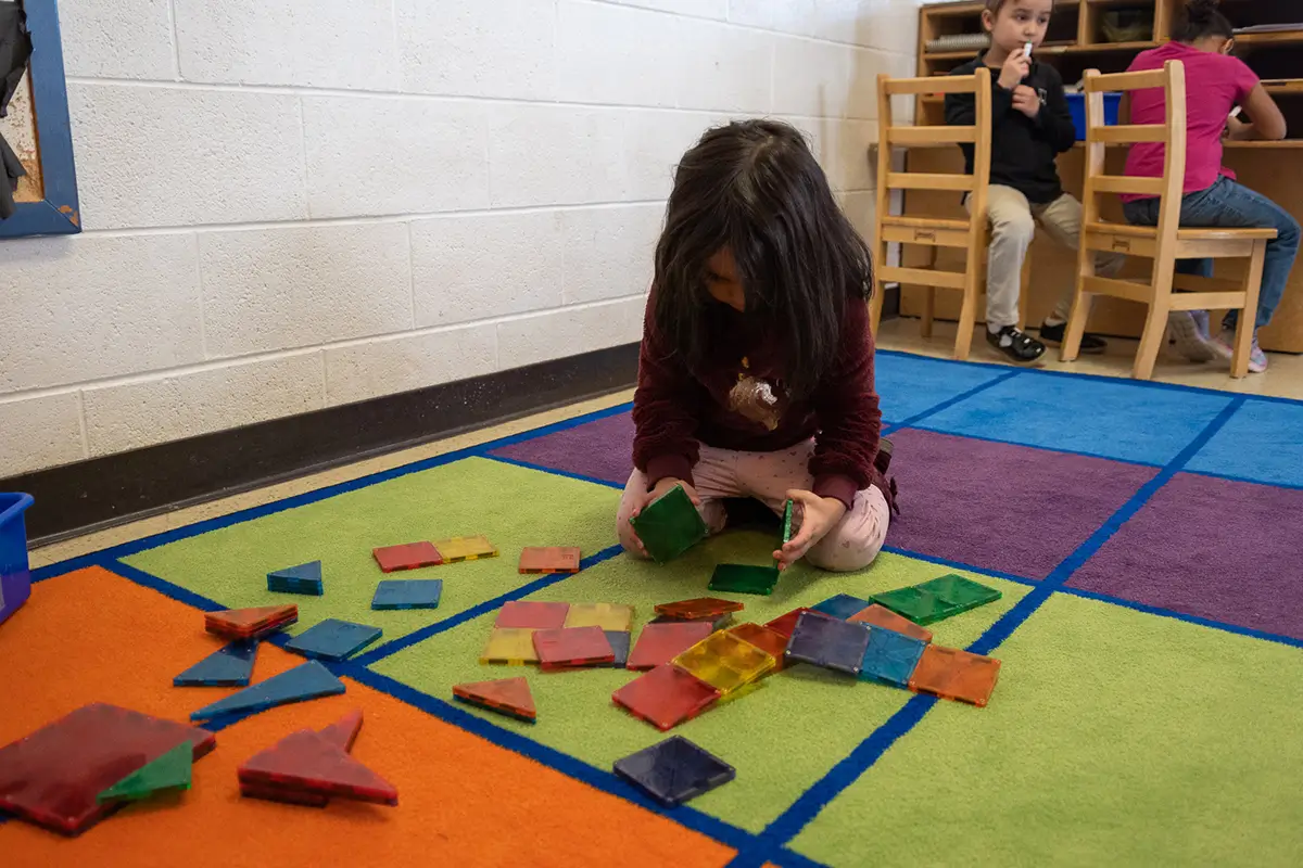 Child playing at a daycare center open on weekends