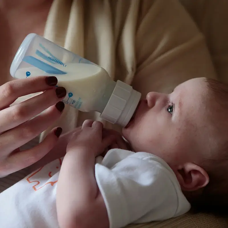 baby-bottle A baby being fed with a bottle full of milk